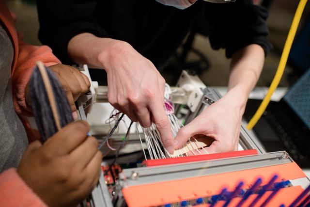 Lab equipment and hands interacting with soft materials